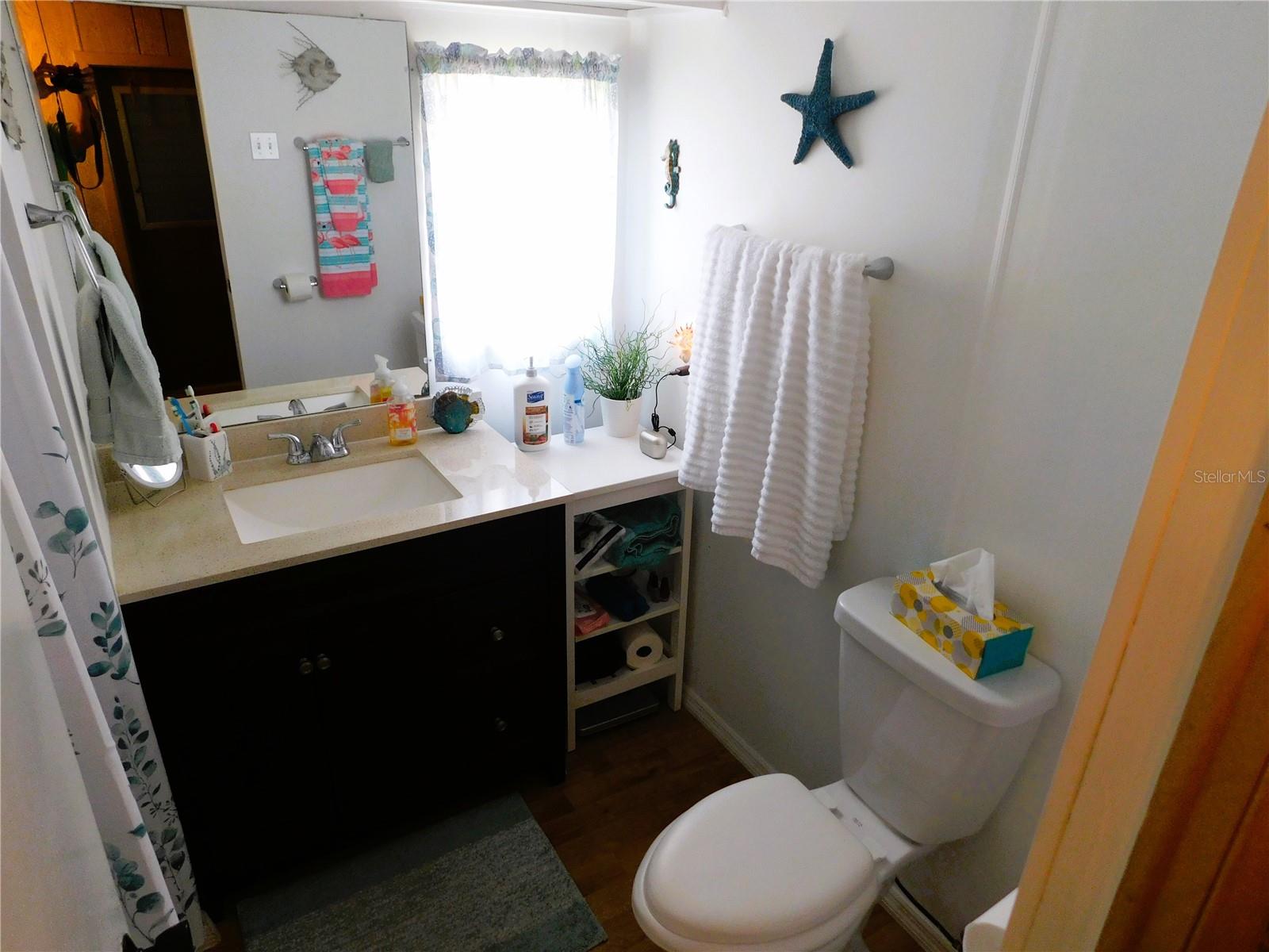 Bathroom has many updates including a step-in shower.