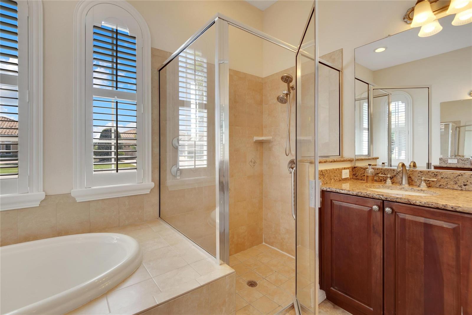 Separate shower or a nice long soak? Granite counter tops and split vanities.