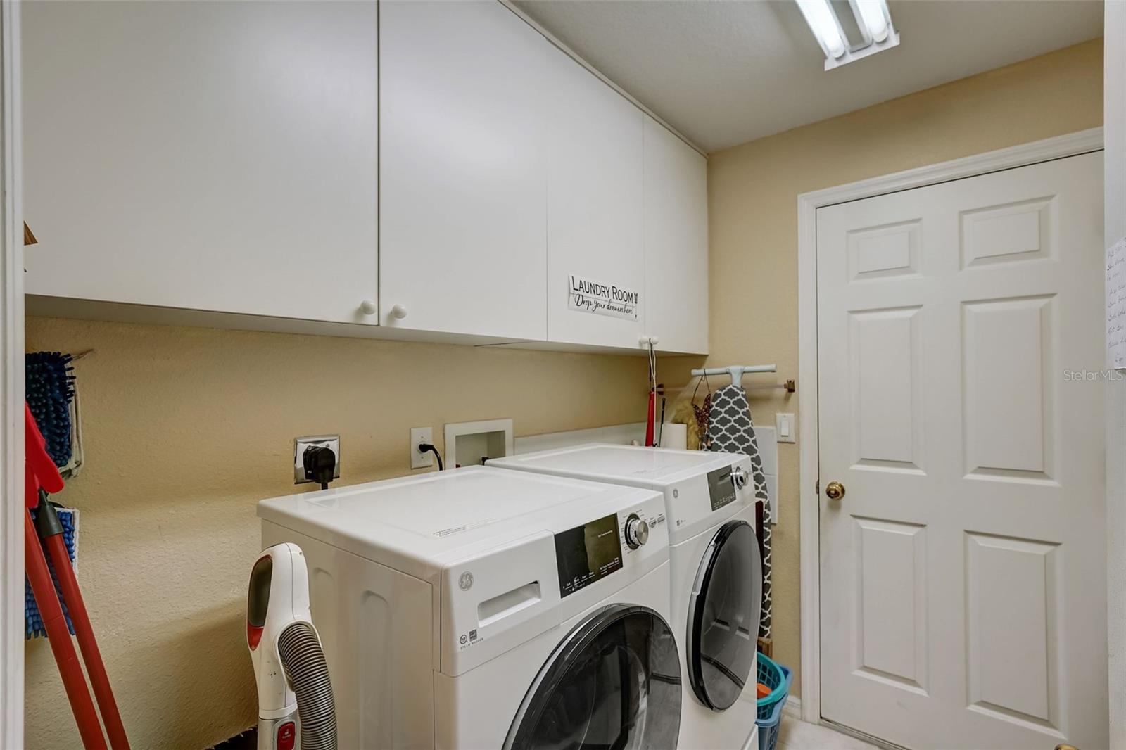 Laundry room separates the bedrooms w/ access to the 2 car gargage.