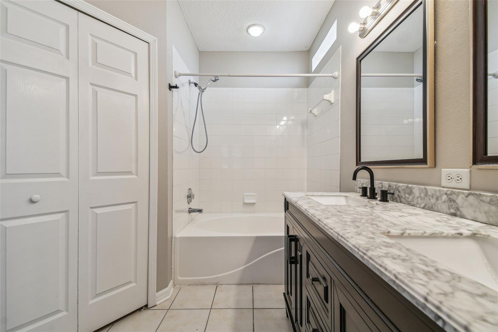 Updated primary bathroom w/double vanities