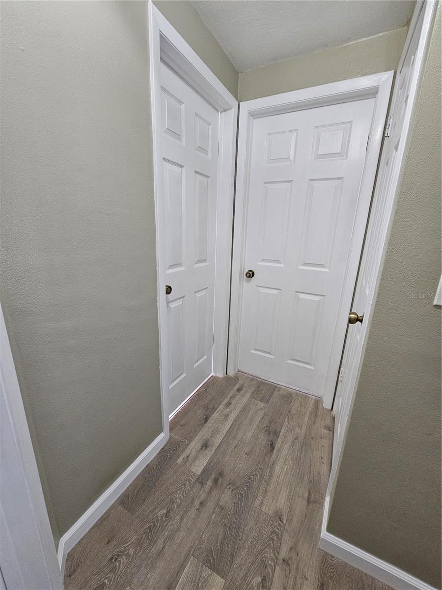Hallway facing Second Room, Hall Bath. Not Seen- Linen Closet on the right side.