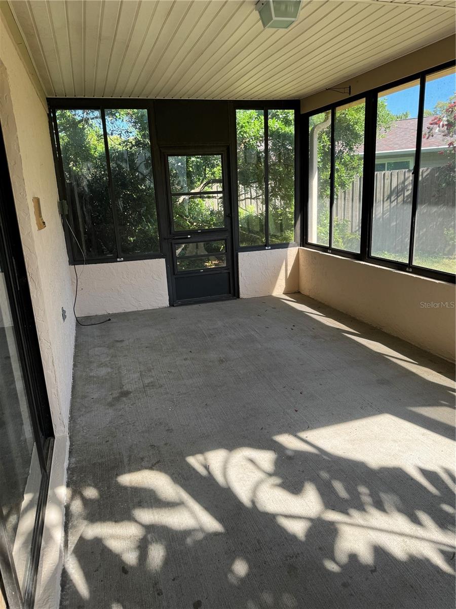 Enclosed patio with back yard access