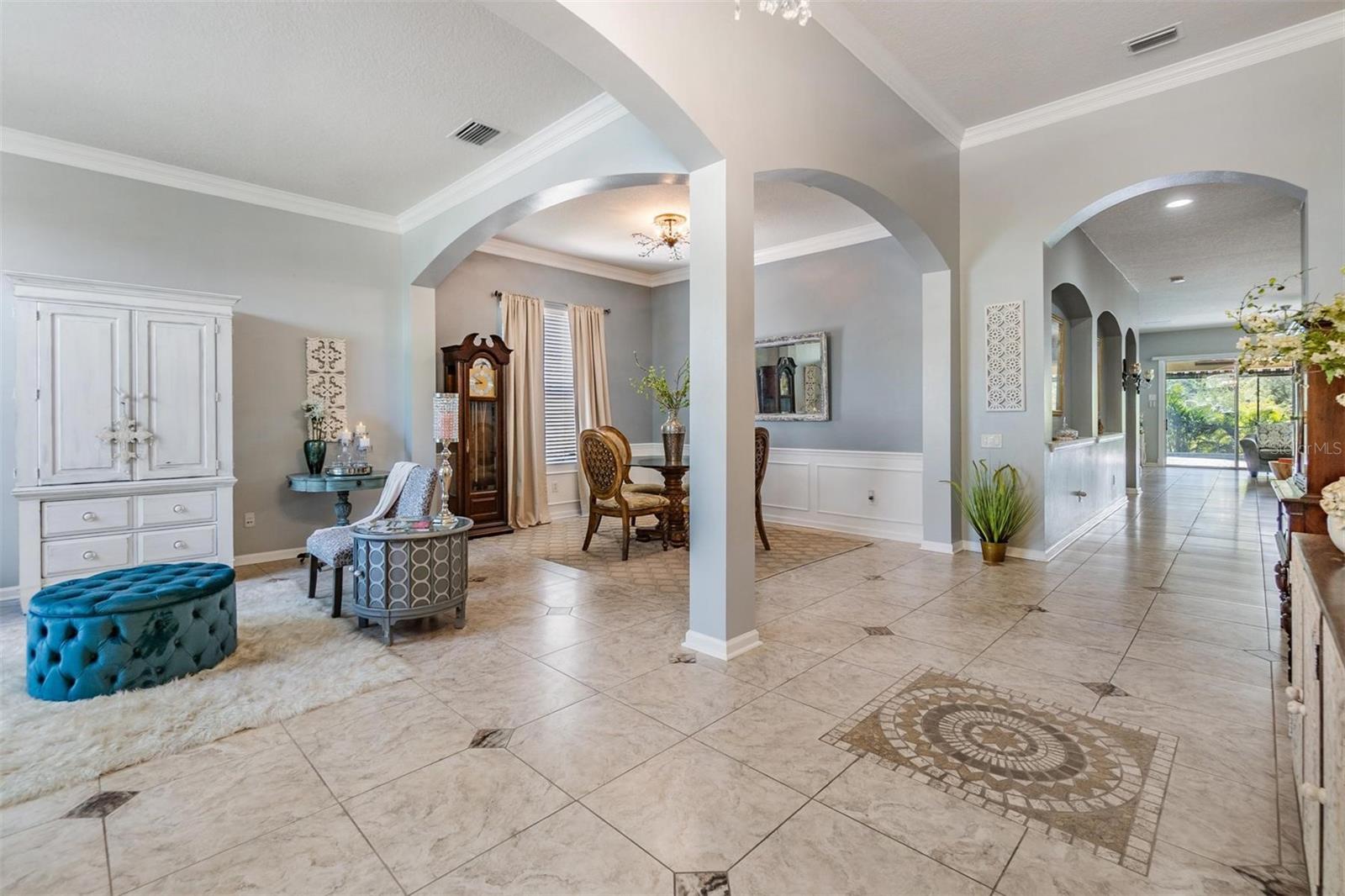 Living Room and Dining Room, Open Floor Plan, Tile Flooring and Large Entryway.