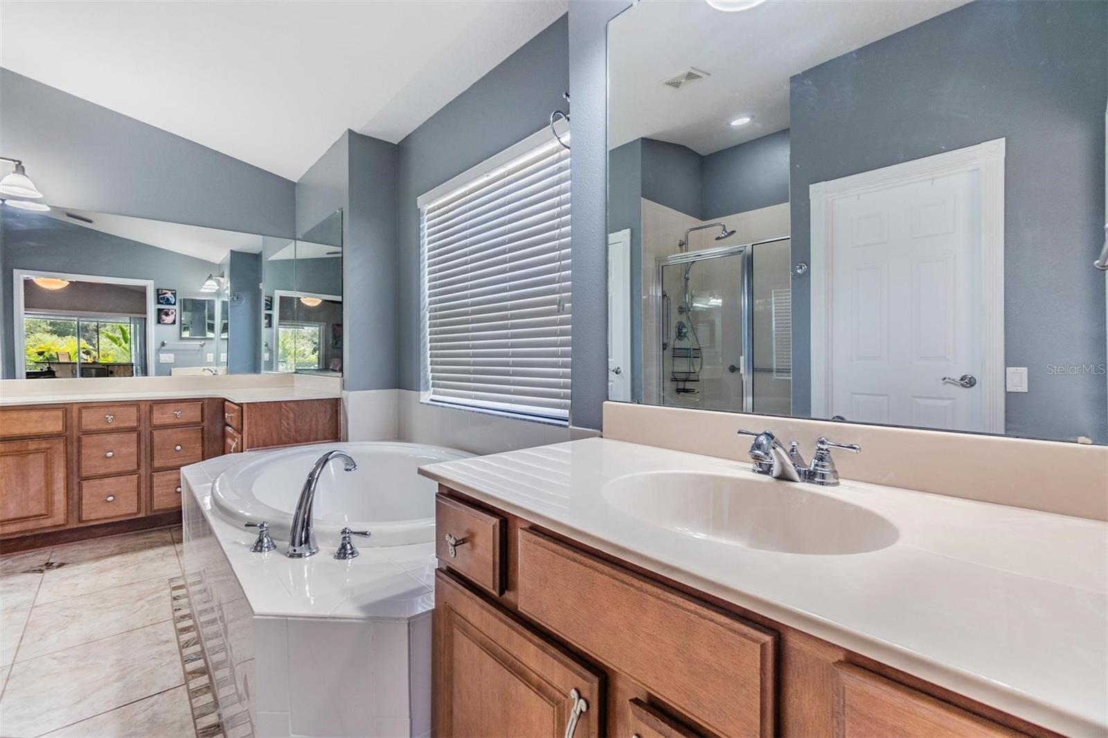 Master Bathroom with Double Vanities and Soaking Tub