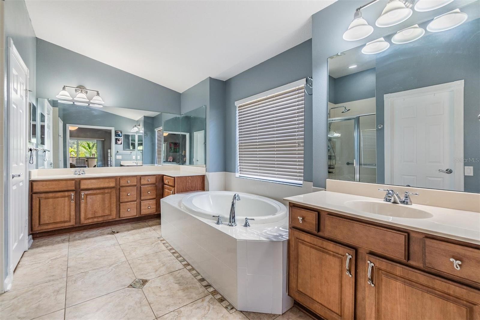 Master Bathroom with Double Vanities and Soaking Tub with Separate Shower.