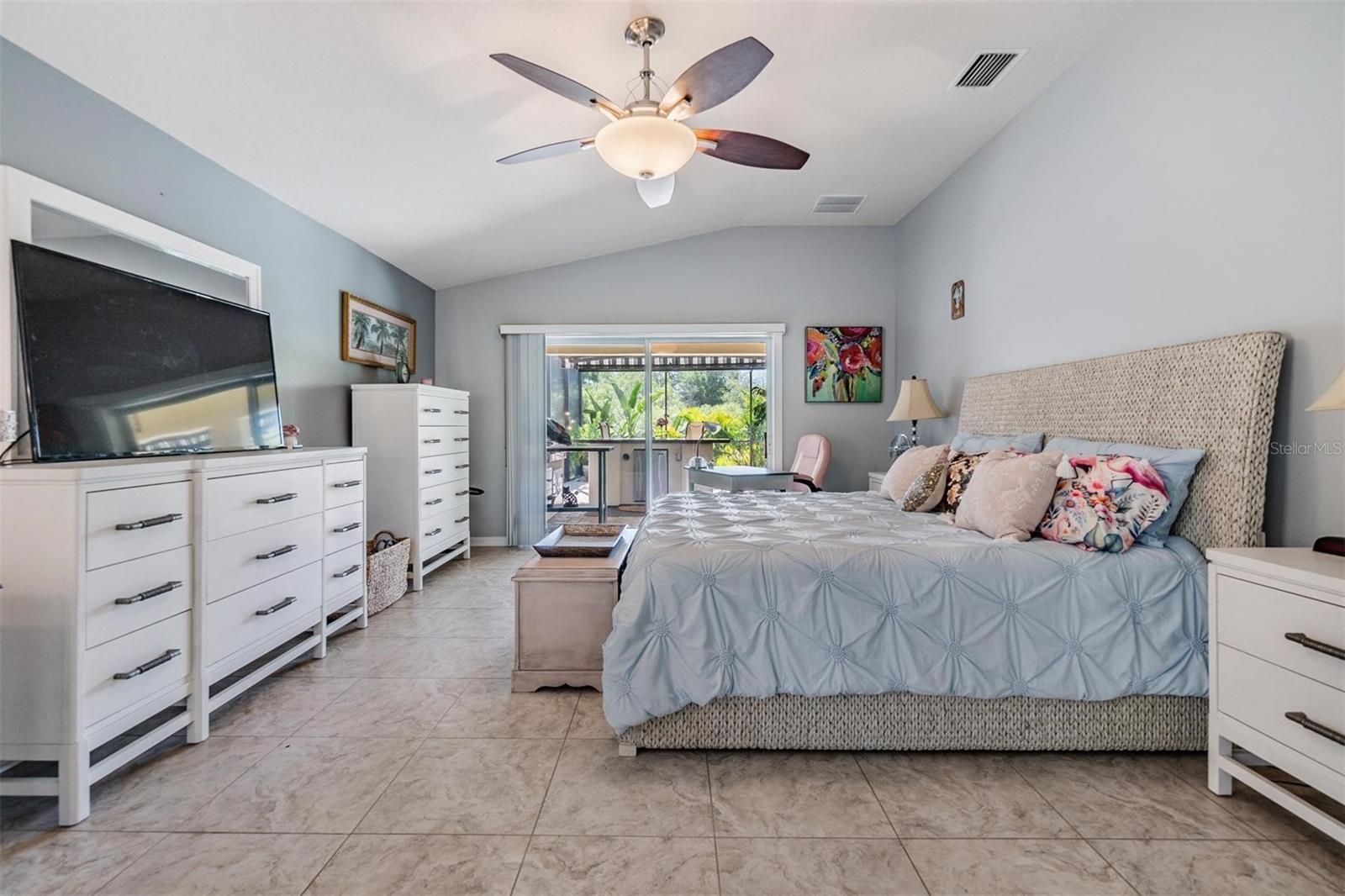 Huge Master Bedroom, Vaulted Ceilings, Ceiling Fan, Tile Flooring with views of the pool and conservation.