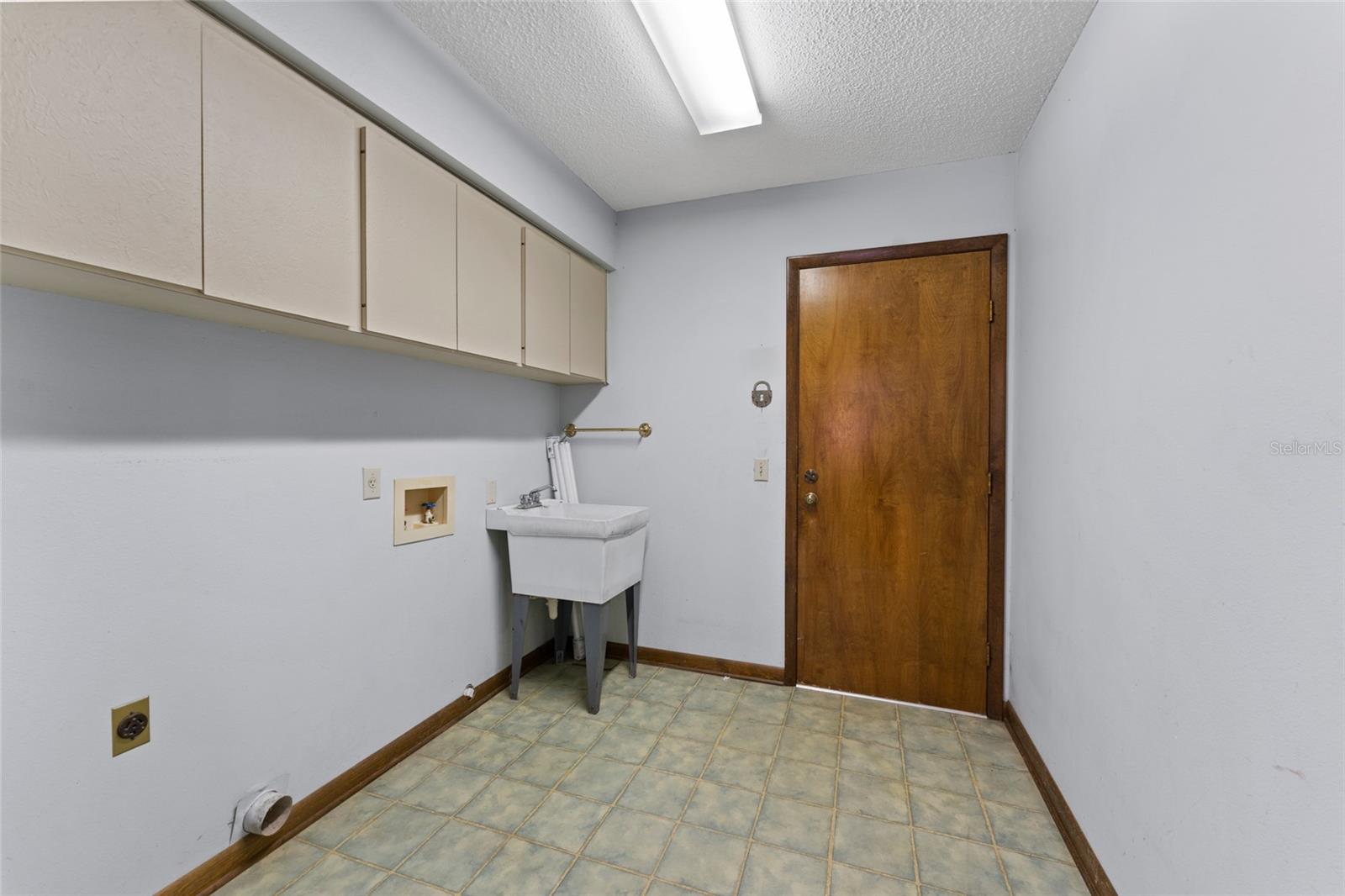 laundry room with entry door from garage