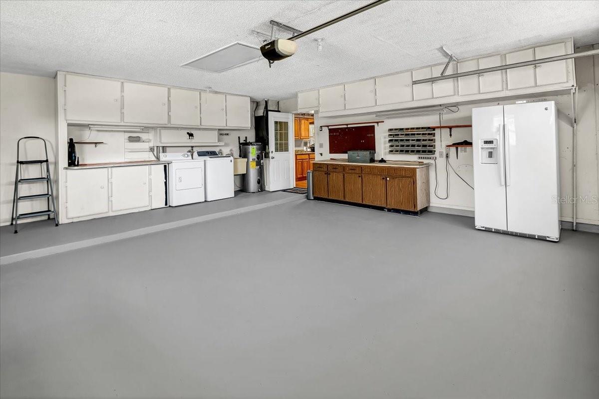 Garage with Washer / Dryer and extra Refrigerator included.