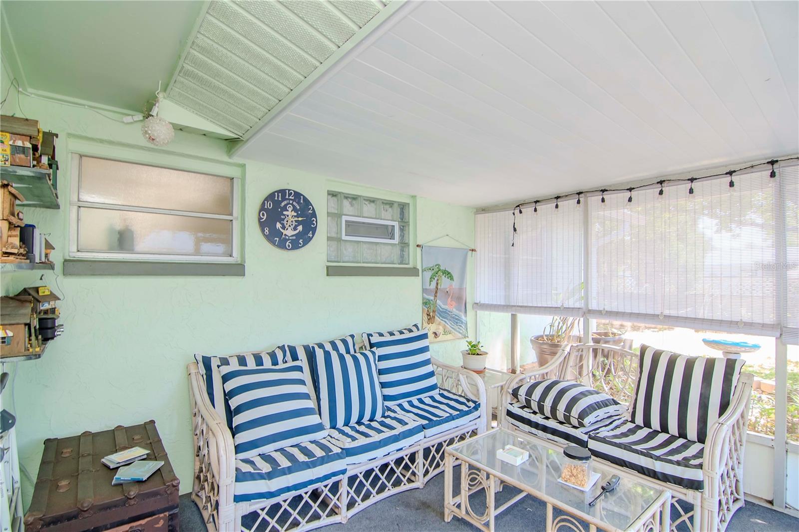 Cozy enclosed porch - perfect for those cool FL nights or morning coffee.