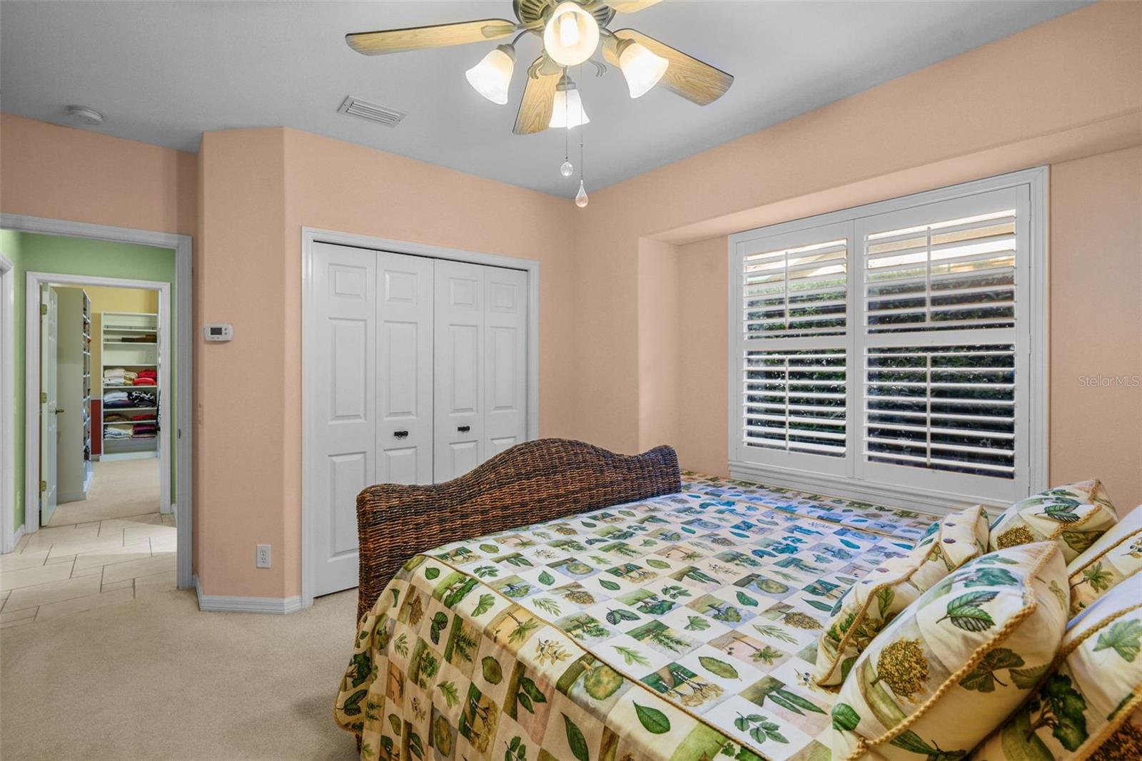 Bedroom 3 with built in window seat and plantation shutters
