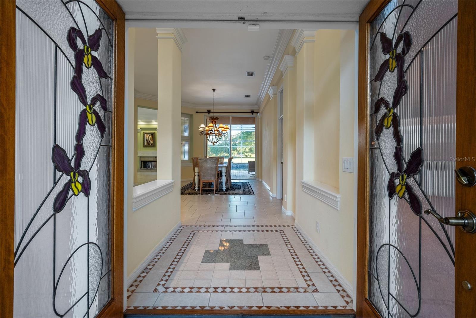 Entry way with double doors open to home