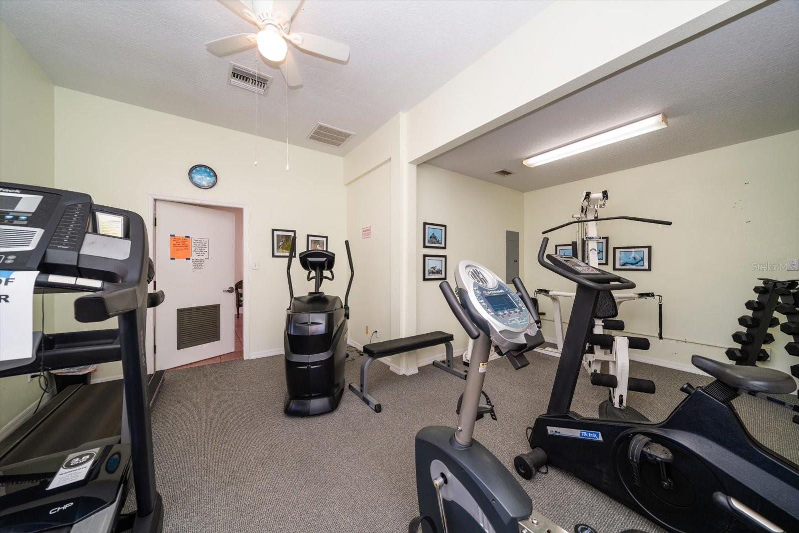 WELL EQUIPPED FITNESS ROOM, LOCATED IN CLUBHOUSE