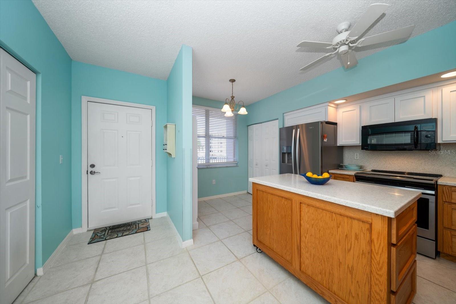 WELCOME IN! THE WASHER/DRYER IS IN CLOSET TO YOUR LEFT AND KITCHEN WITH A SMALL DINING AREA TO YOUR RIGHT.