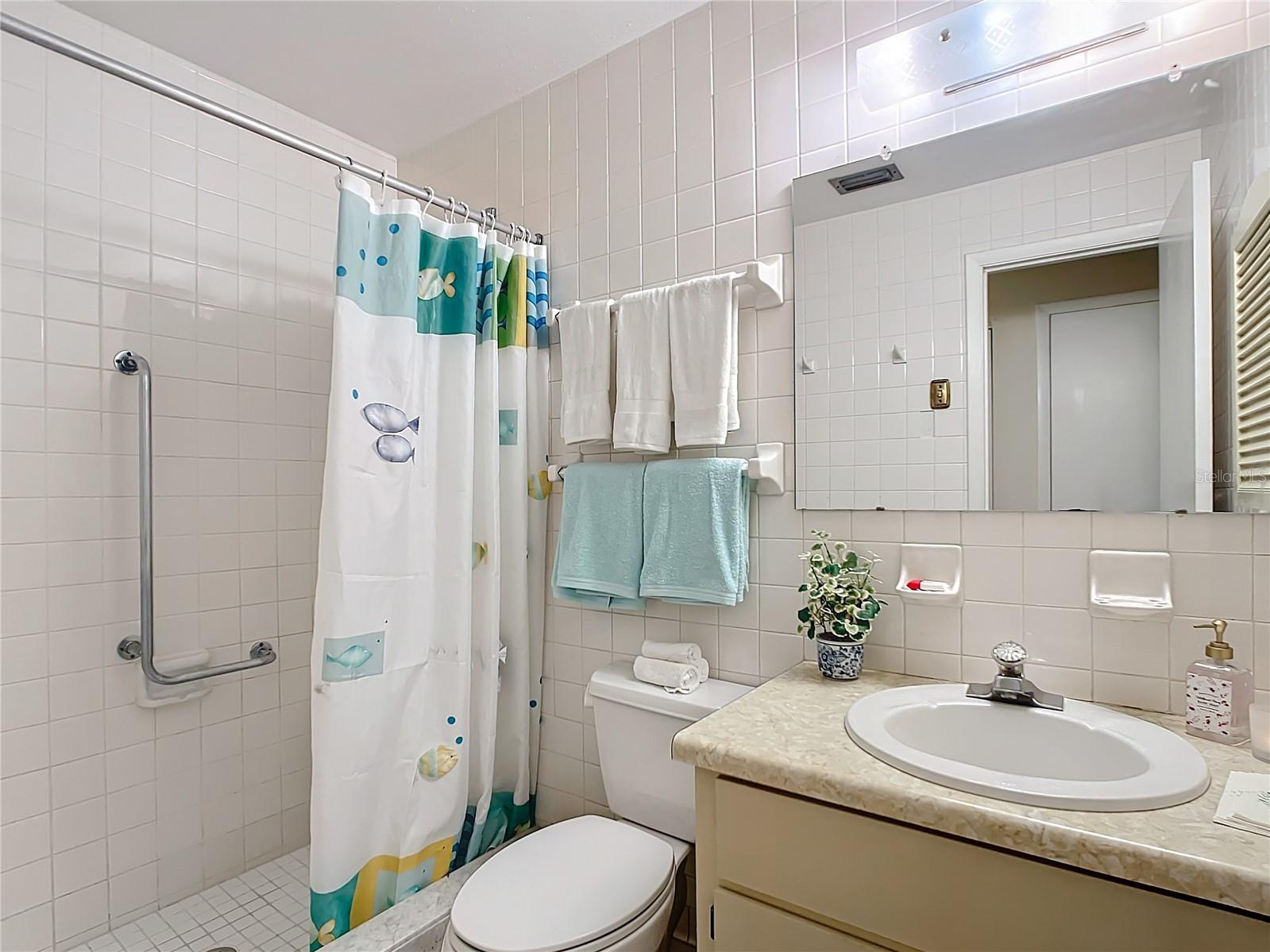 Bathroom showing updated shower
