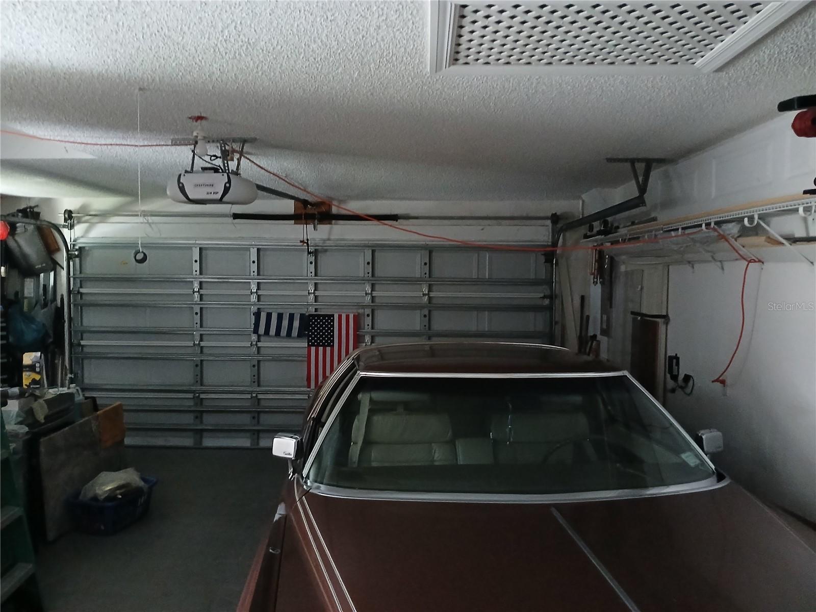Two car side garage with auto door opener.