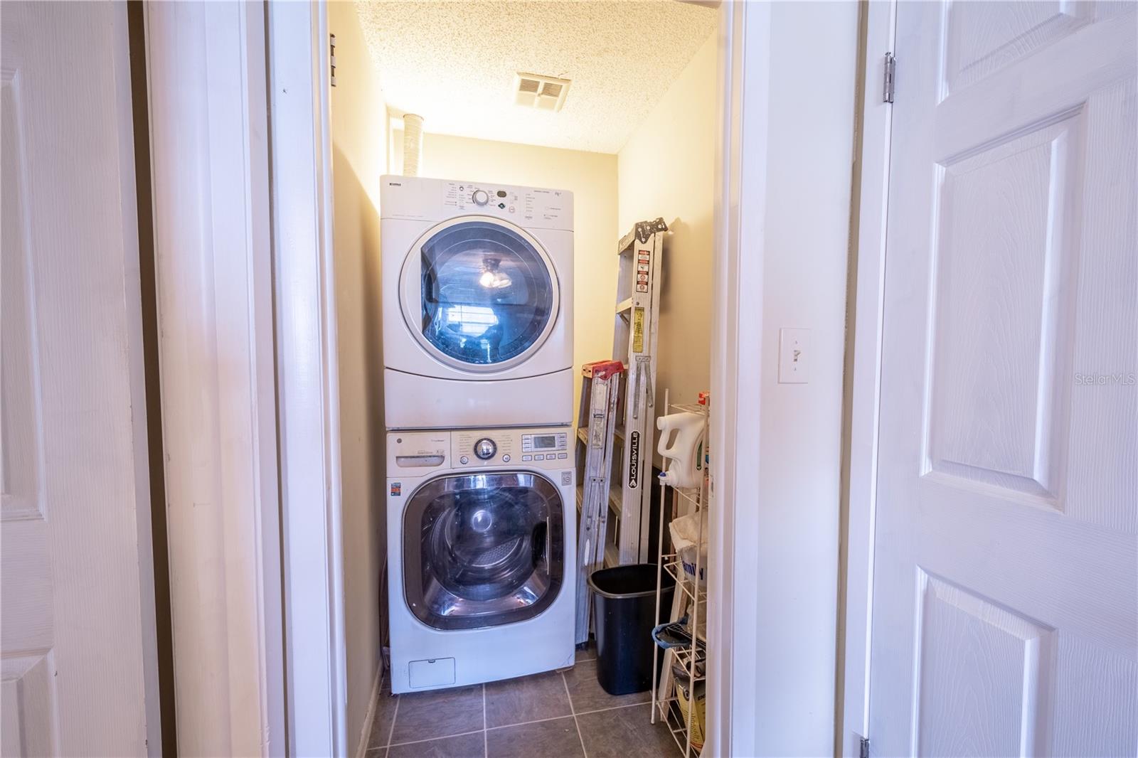 The half bath has been converted into a laundry room but can easily be converted back to a half bath.