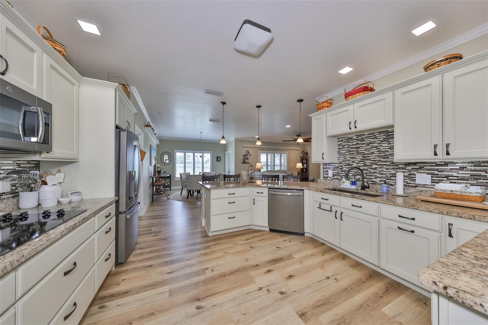 This huge kitchen is equipped with all newer stainless steel appliances (Refrigerator is 1 week old) and includes upgraded granite countertops with 42" all wood cabinets.
