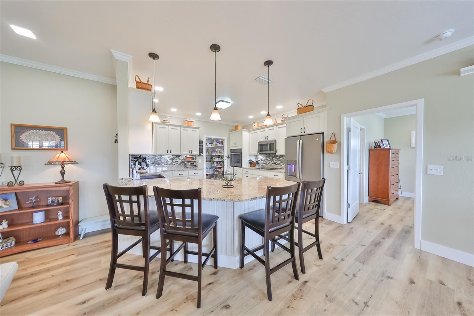 Kitchen has all the upgrades and features to cook comfortably, even with multiple cooks and entertain at the same time, with a large seated breakfast bar and recessed lighting, it's a perfect spot to catch up with friends and family.