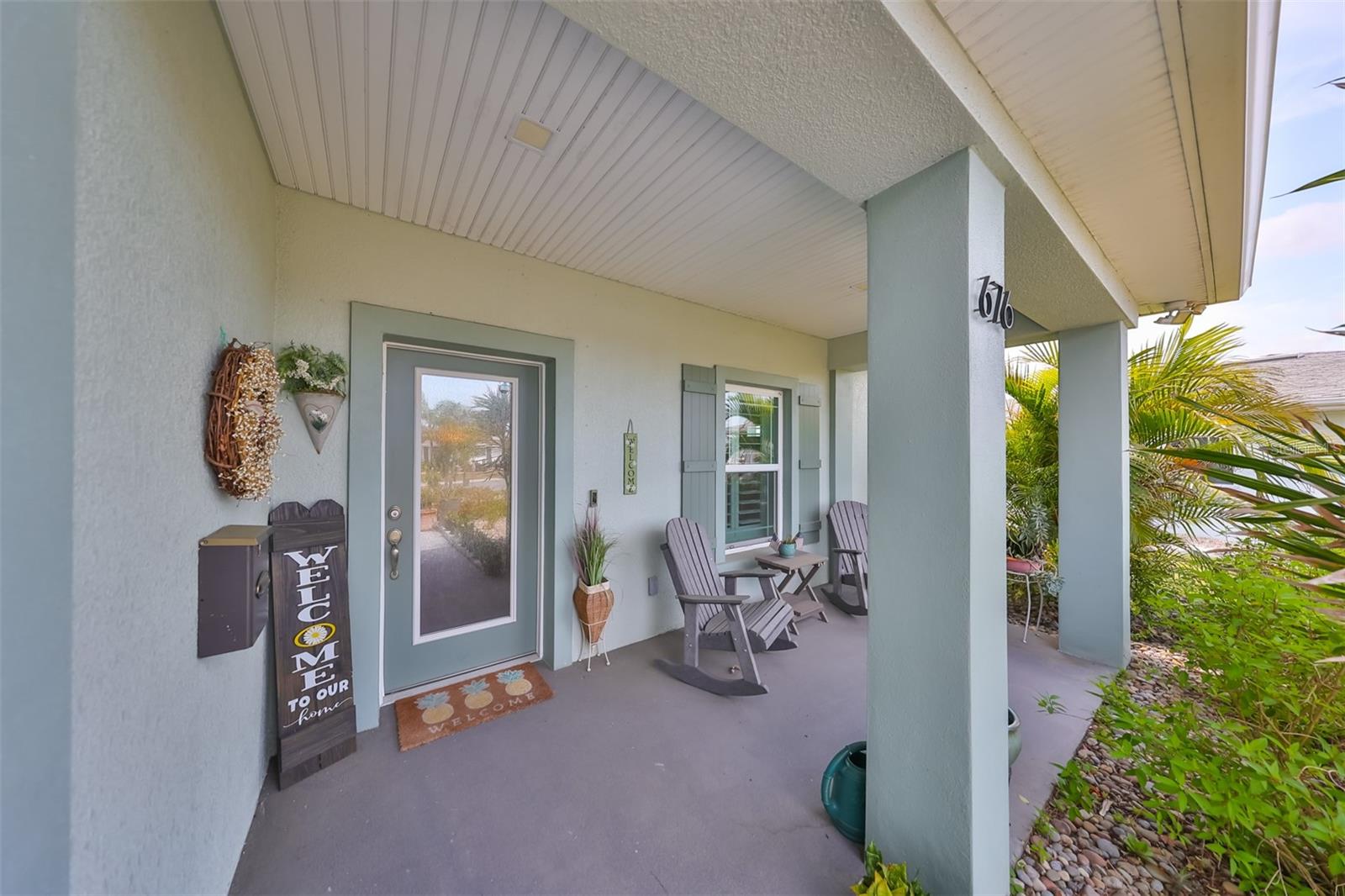As you walk up to the front entrance, notice this gorgeous covered ranch style front porch! Perfect for rocking and sipping tea while sitting back and watching the world go by.