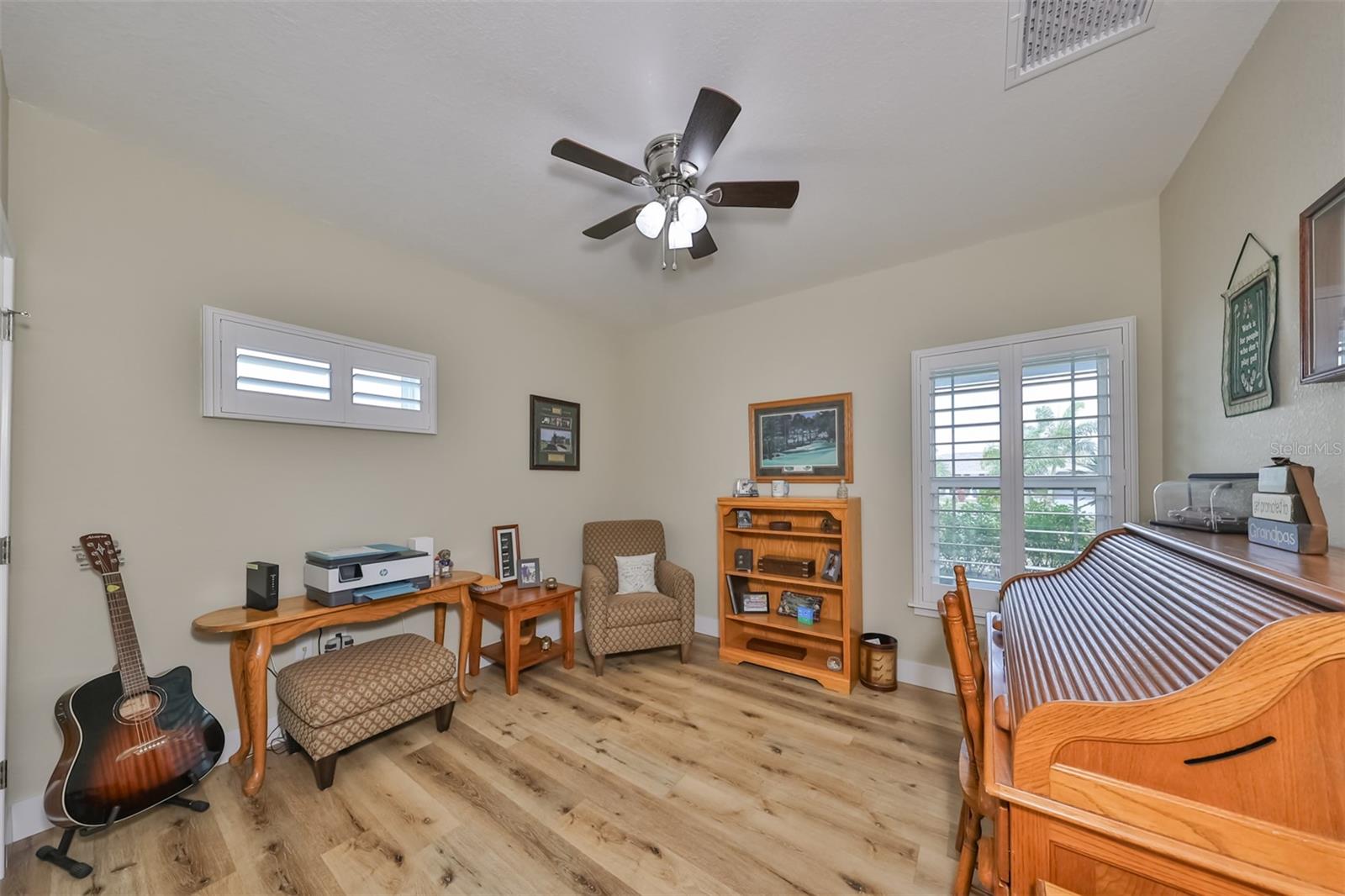 Office/Bedroom offers additional brightness from both the ceiling fan lighting and windows.
