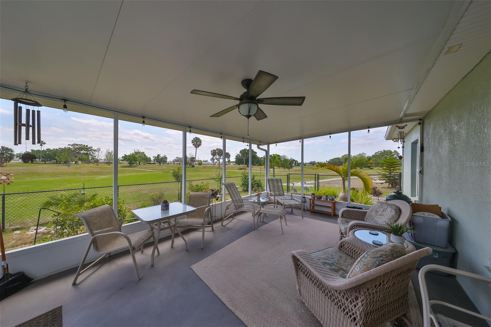 Covered, large screened patio includes custom ceiling fan with lighting perfect for enjoying all year round. NO BACKYARD NEIGHBORS!