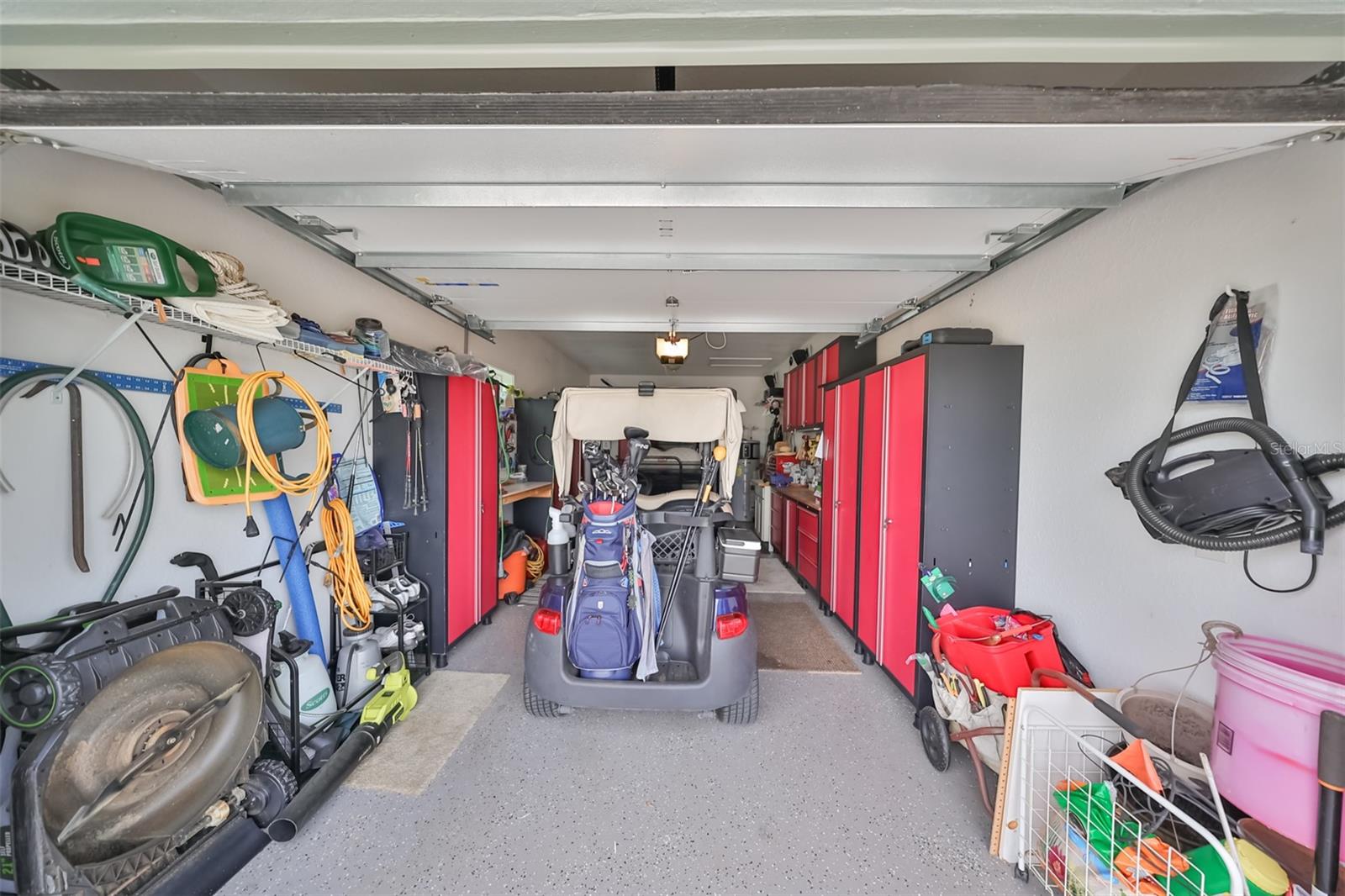 Second, connected garage space is large enough for a car, with epoxy flooring and perfect for tools and a golf cart or another car to fit!
