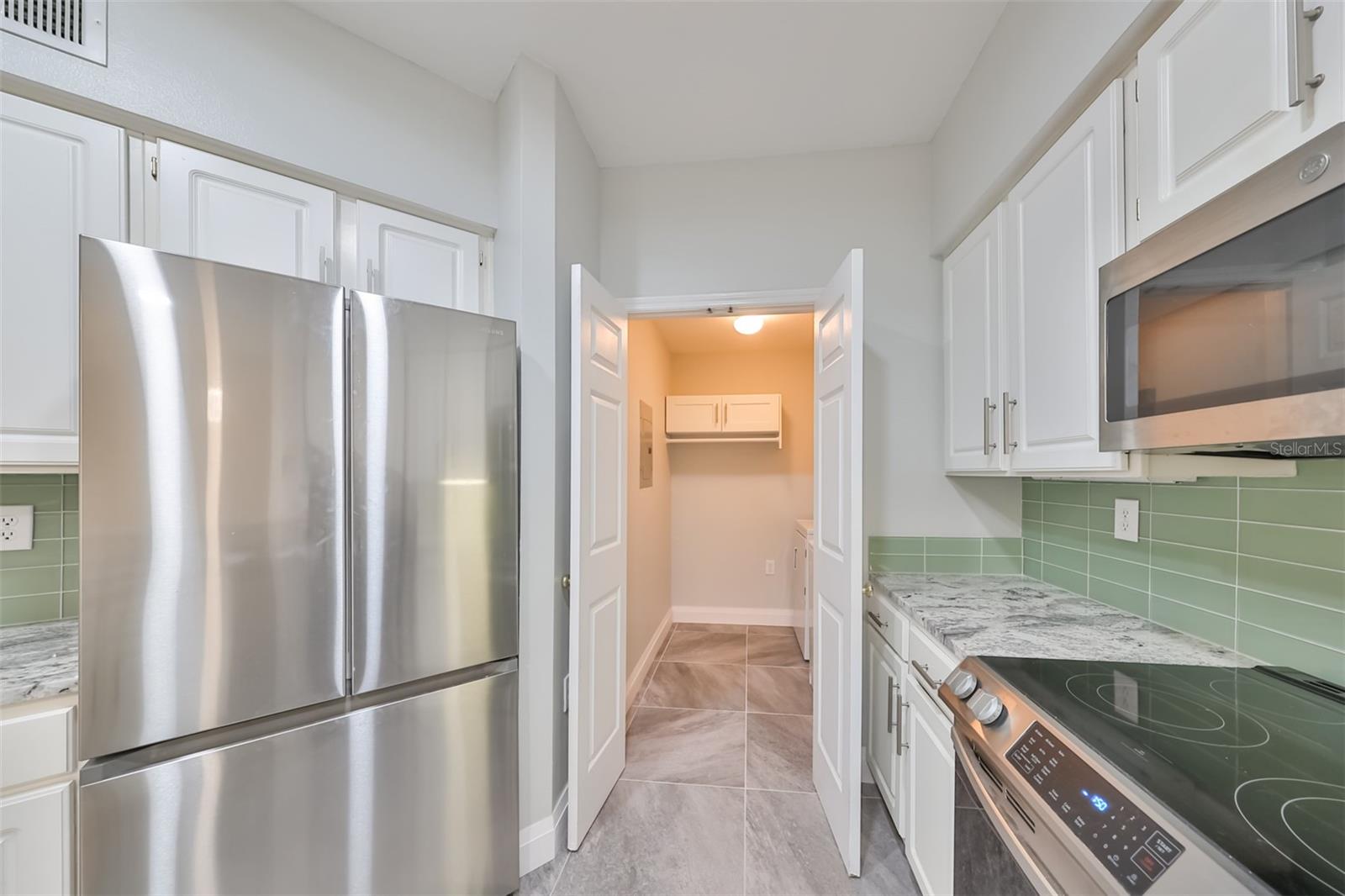 Spacious laundry room just off kitchen