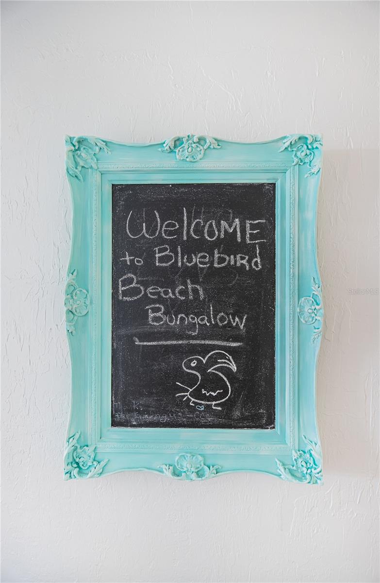 Welcome to the Bluebird Beach Bungalow sign