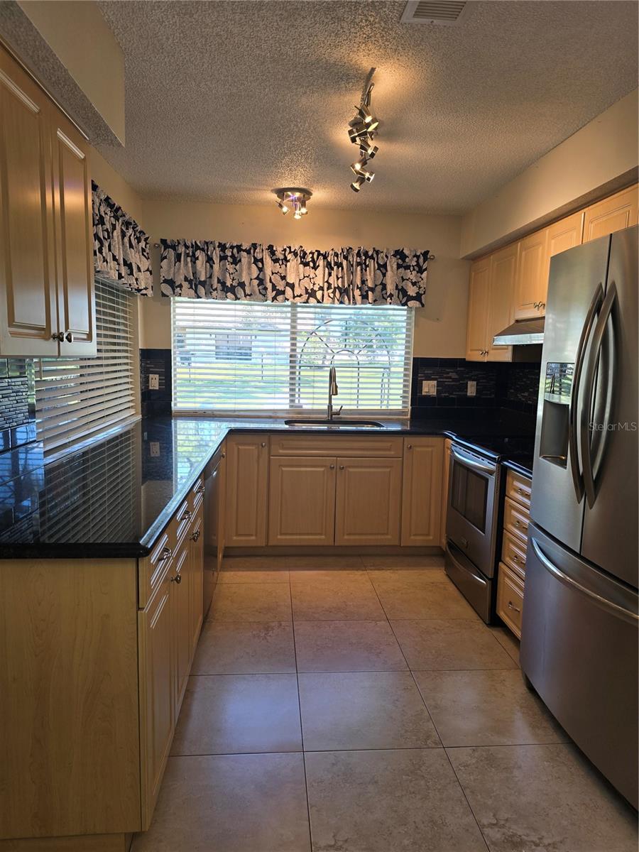Updated kitchen with lots of granite counter $3000 AND NEW DISPOSAL 2024