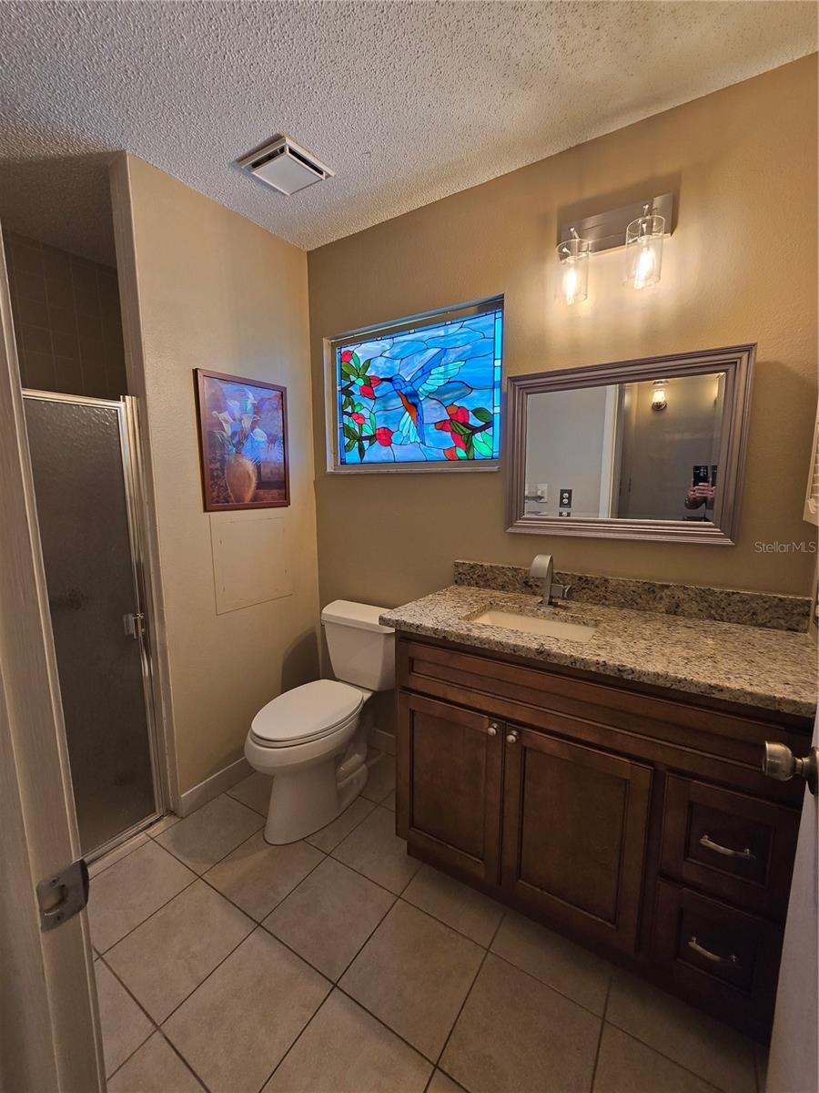 PRIMARY BATH NEW GRANITE, VANITY, SINK, FAUCET, TOLIET AND MIRROR 2023 $1500