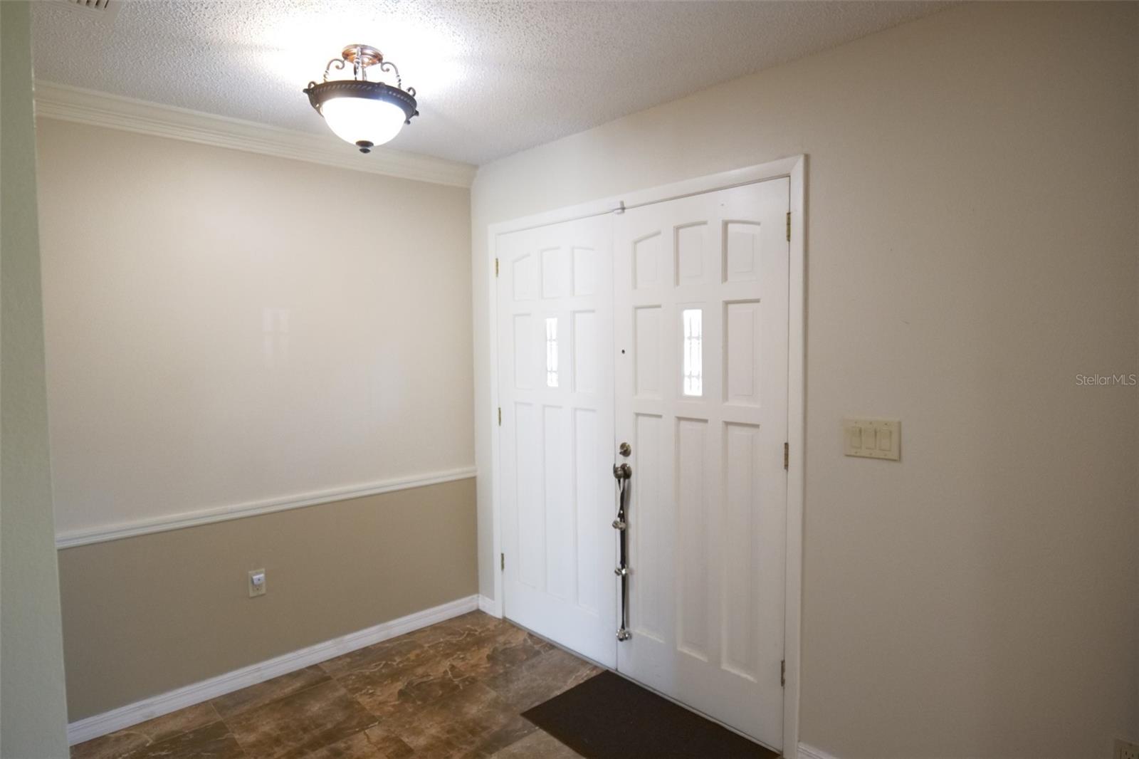 Foyer with a large closet