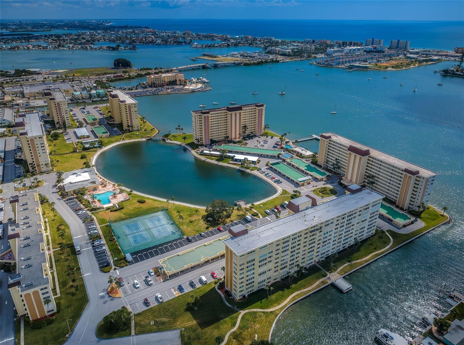 .. The Sea Towers Resort Community Consists of 7 Buildings That Share Common Grounds. Very Active Young 55+ Community. Wonderful Aerial of Surrounding Water.