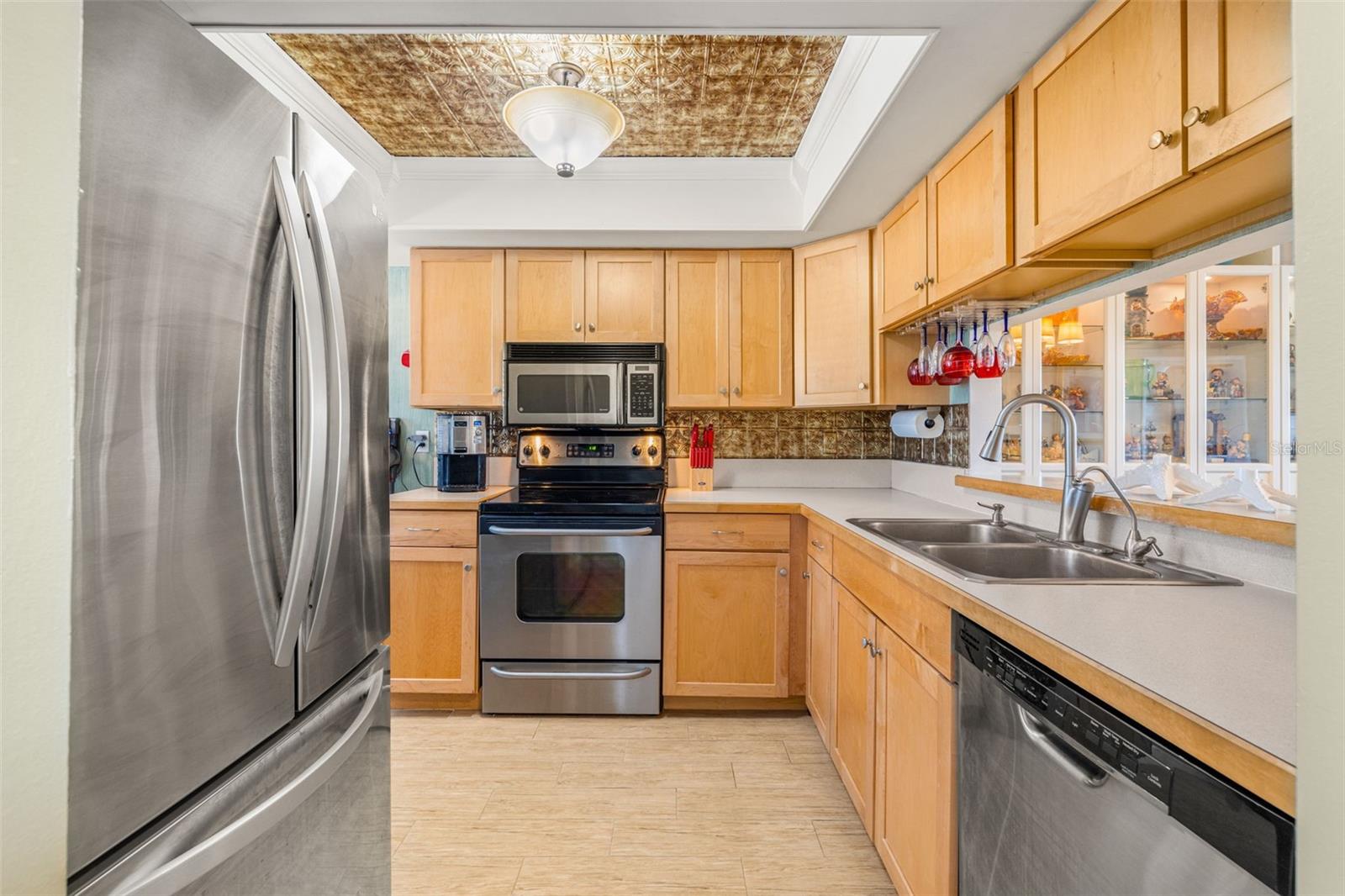 Beautiful updated kitchen with Birch custom cabinetry and stainless steel appliances!