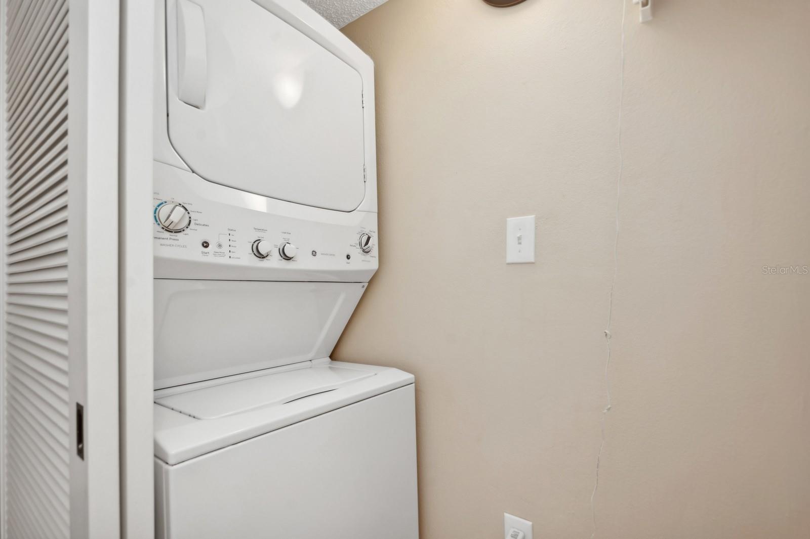 Laundry Room is located in the hallway between the Guest Bedroom and Bathroom.