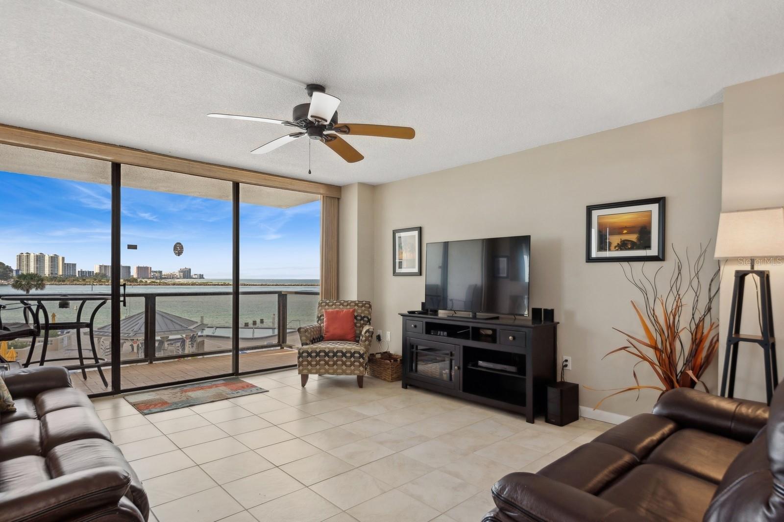Living Room opens directly to the Balcony overlooking the Pool Deck, Pool, Clearwater Pass and Sand Key.