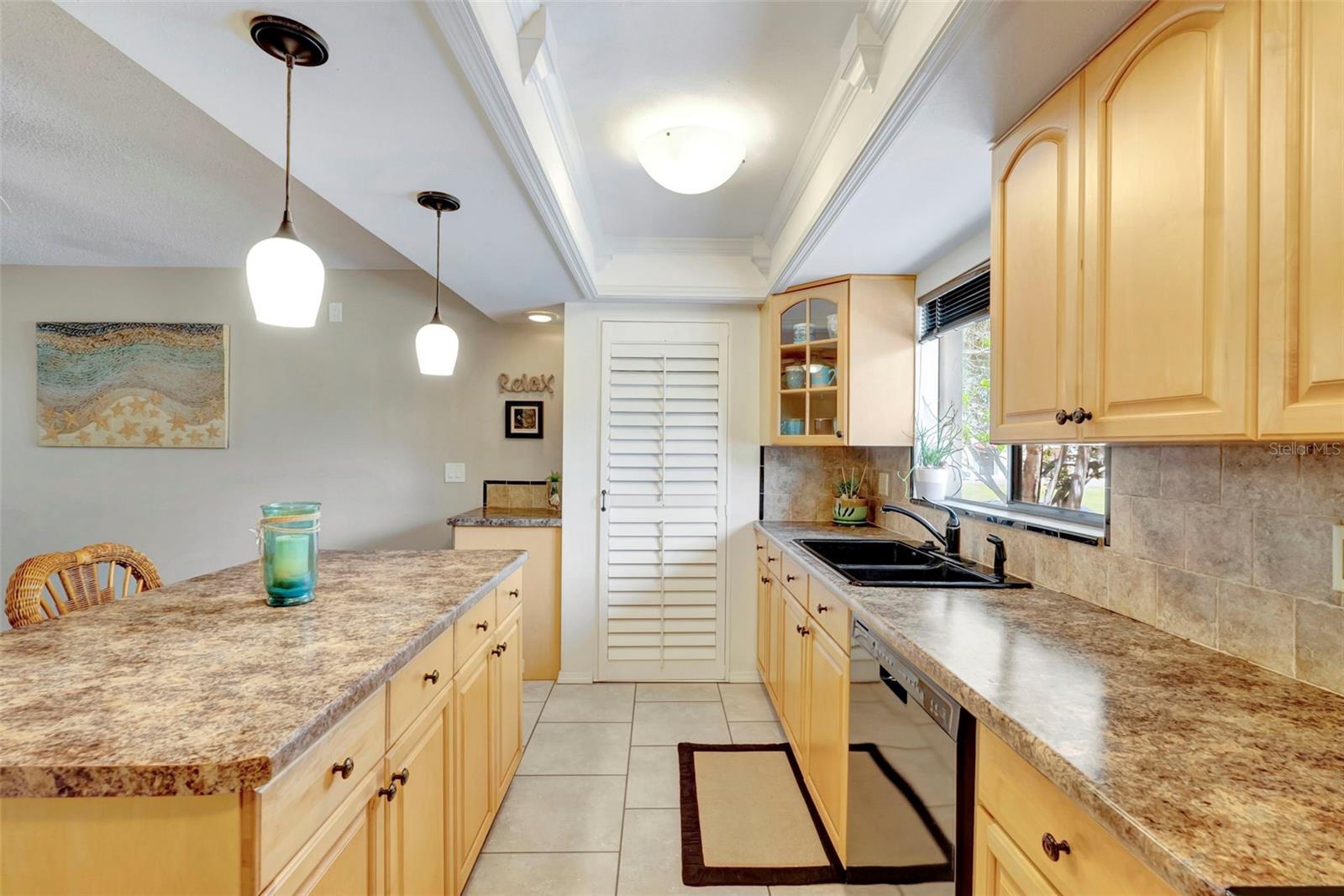 The kitchen is bright and spacious for entertaining and has a pantry.