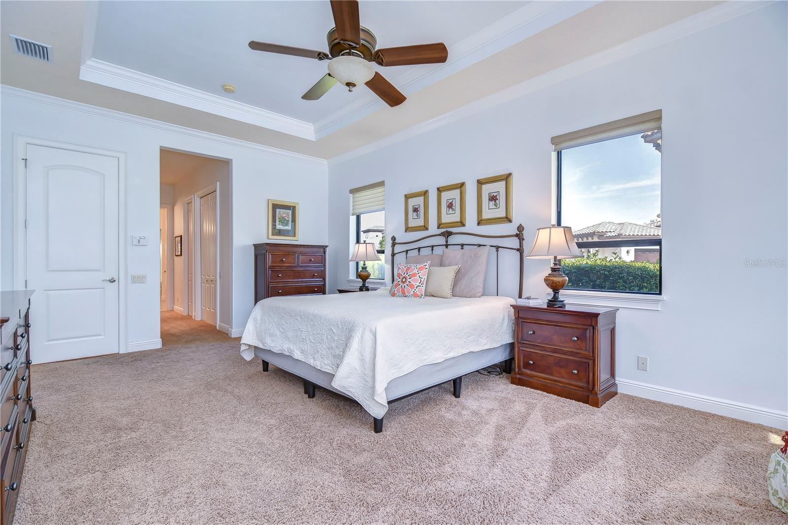 Situated in a private wing of the home features private access to the lanai, his and her walk-in closets!