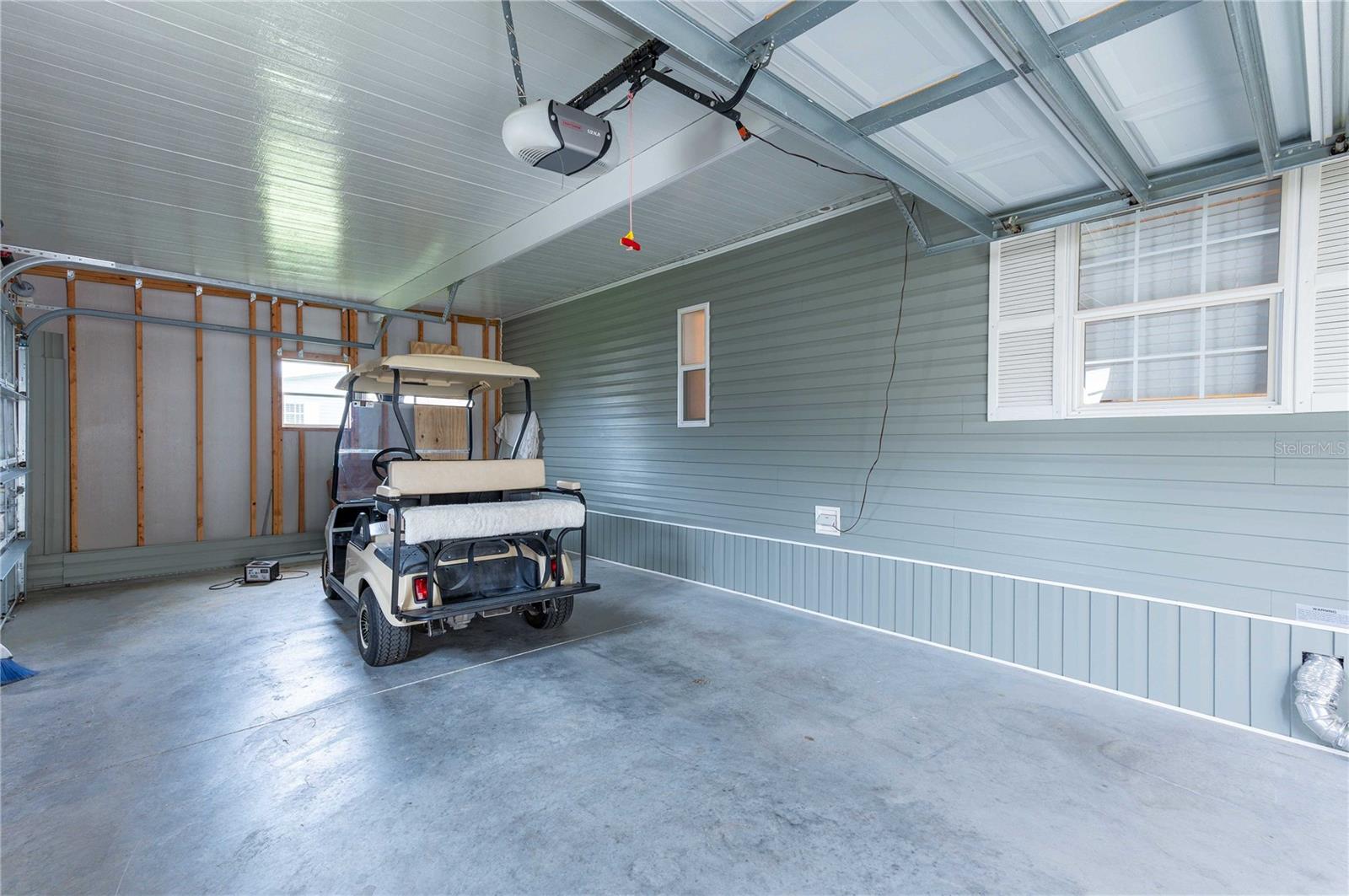 Two car garage and golf cart storage.