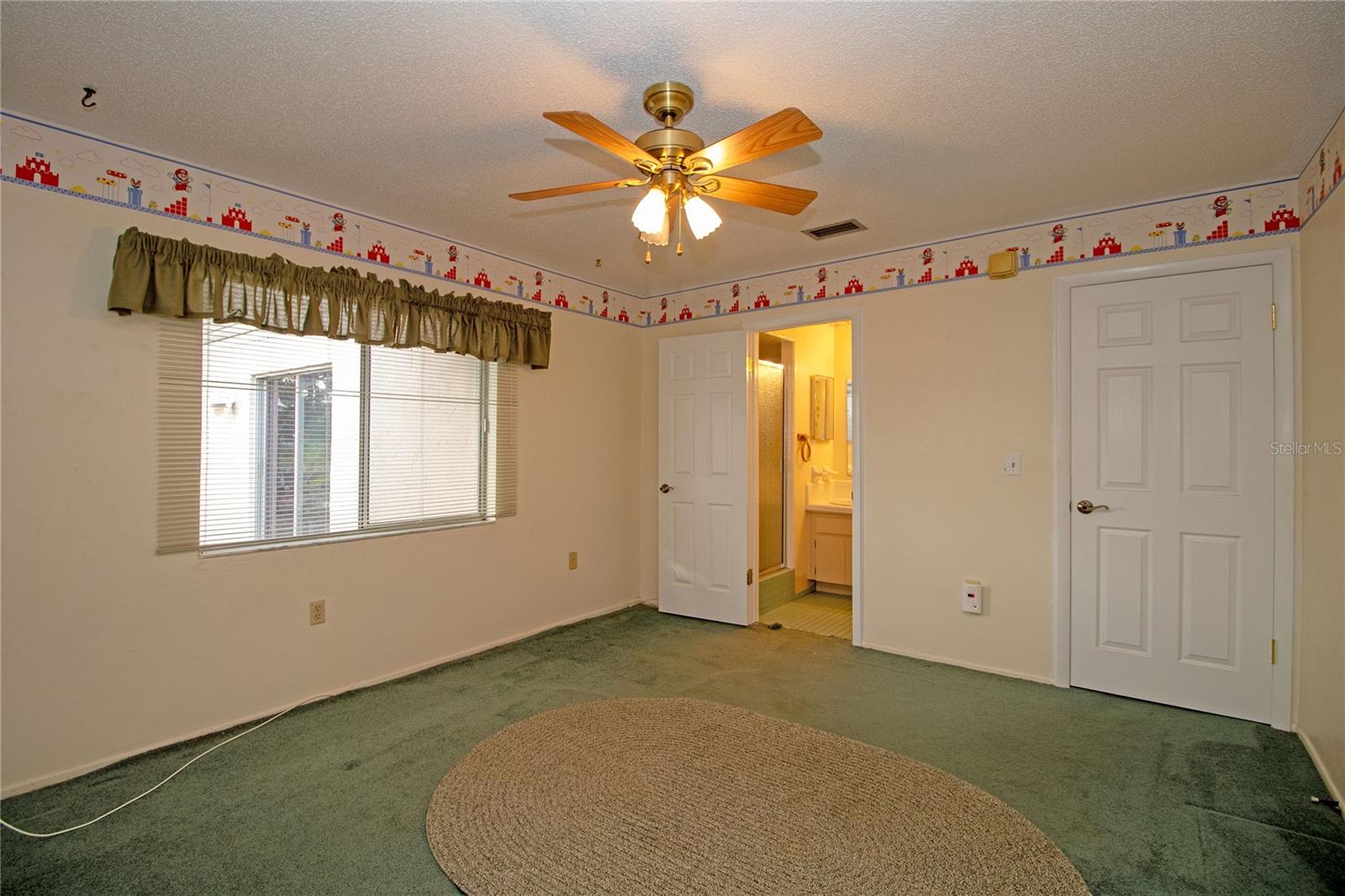 Downstairs bedroom with ensuite bathroom.