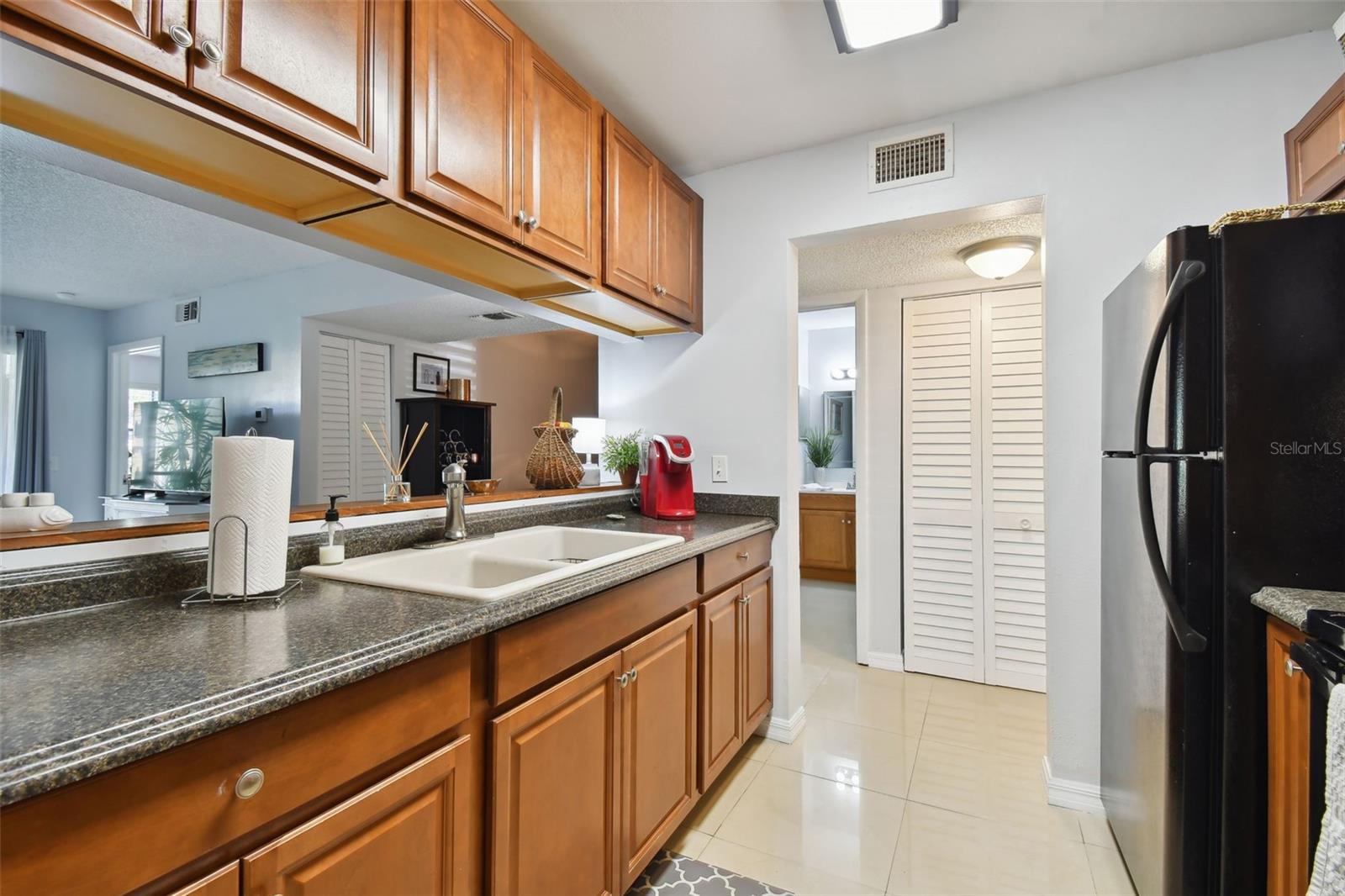 Spacious kitchen with granite counter tops and plenty of cupboard space.