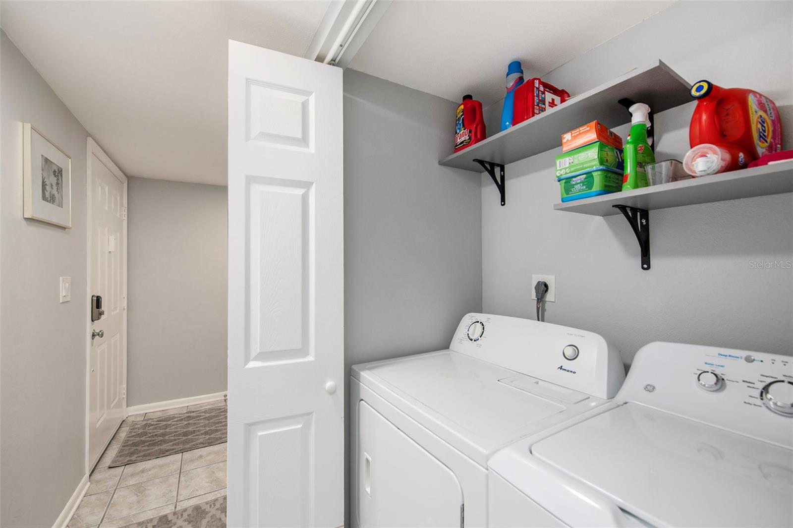 Laundry is located in the home’s front hallway near the second bedroom