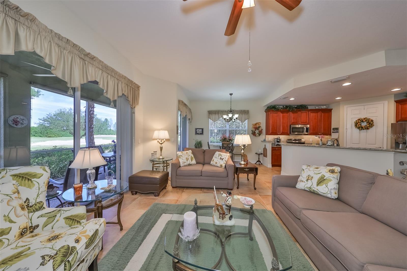 The large triple sliding glass doors and windows allow Florida sunshine to fill the home.  Relax and enjoy the animation from the Golf Course at Renaissance right from the comfort of your own couch.