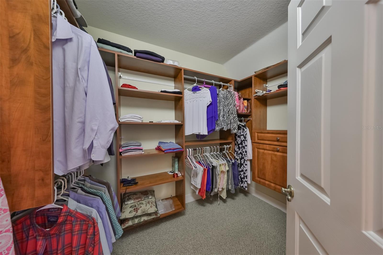 Owners suite has a 'California Style' walk-in closet with custom shelving for ultimate organization.