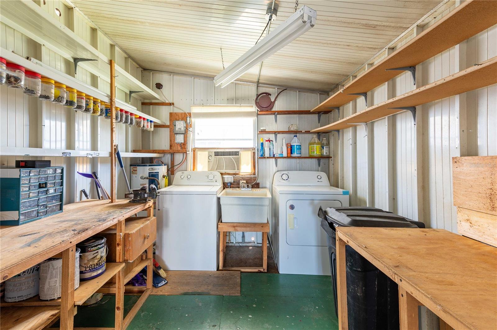 Workshop and laundry area off of screen room.