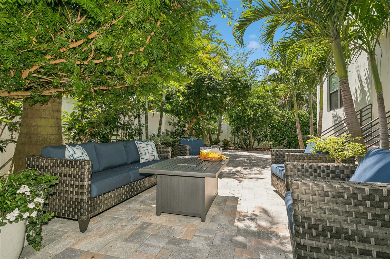 Backyard with mature lush landscaping that provides privacy and shade...
