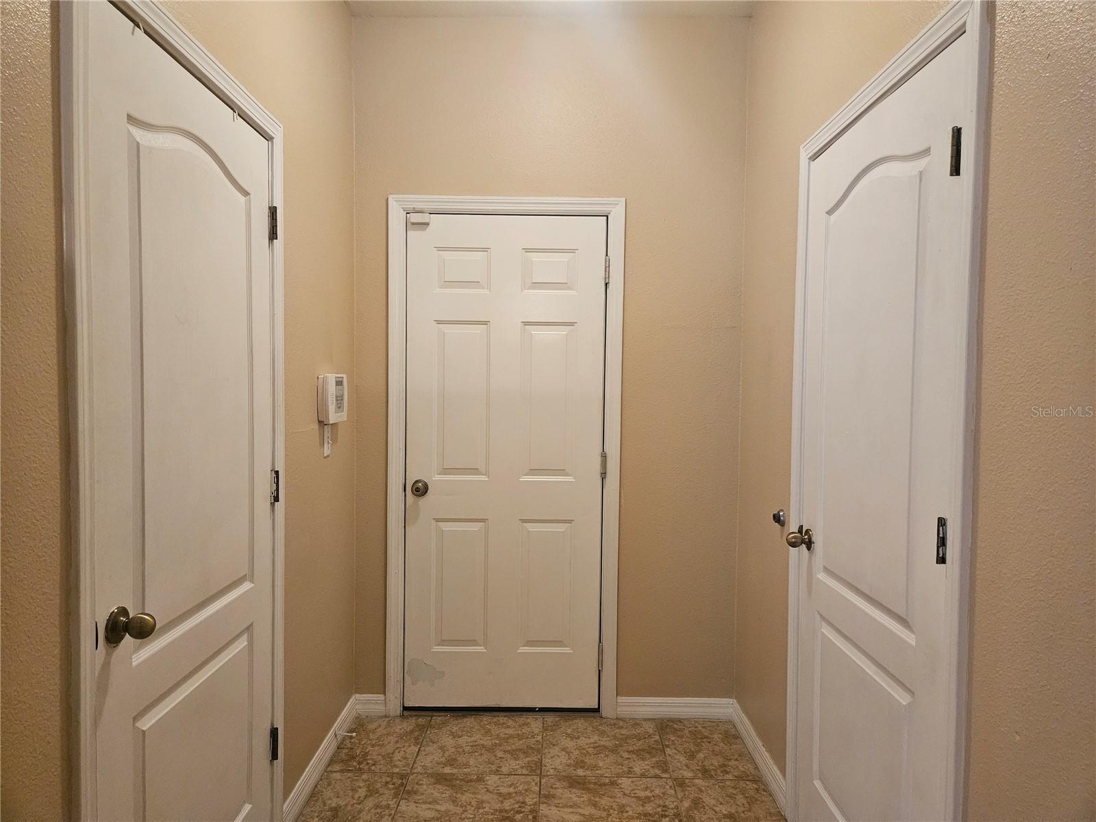 Downstairs Hall with Laundry Room and Half Bath