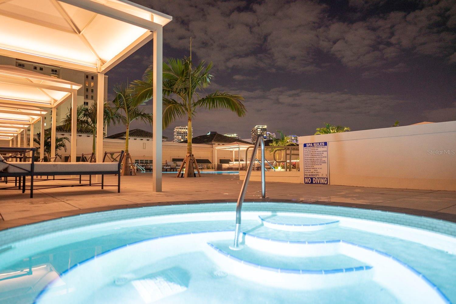 Indulge in relaxation with the hot tub conveniently located near the pool, complete with a pool shower.