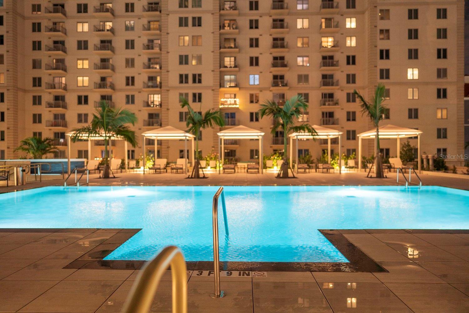 Relax and enjoy the heated pool with stunning city views.