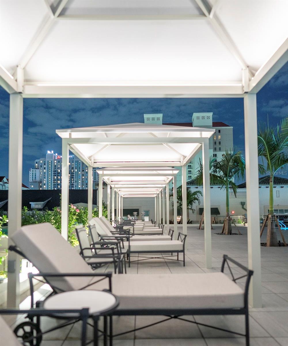 Poolside cabanas are available for your relaxation.