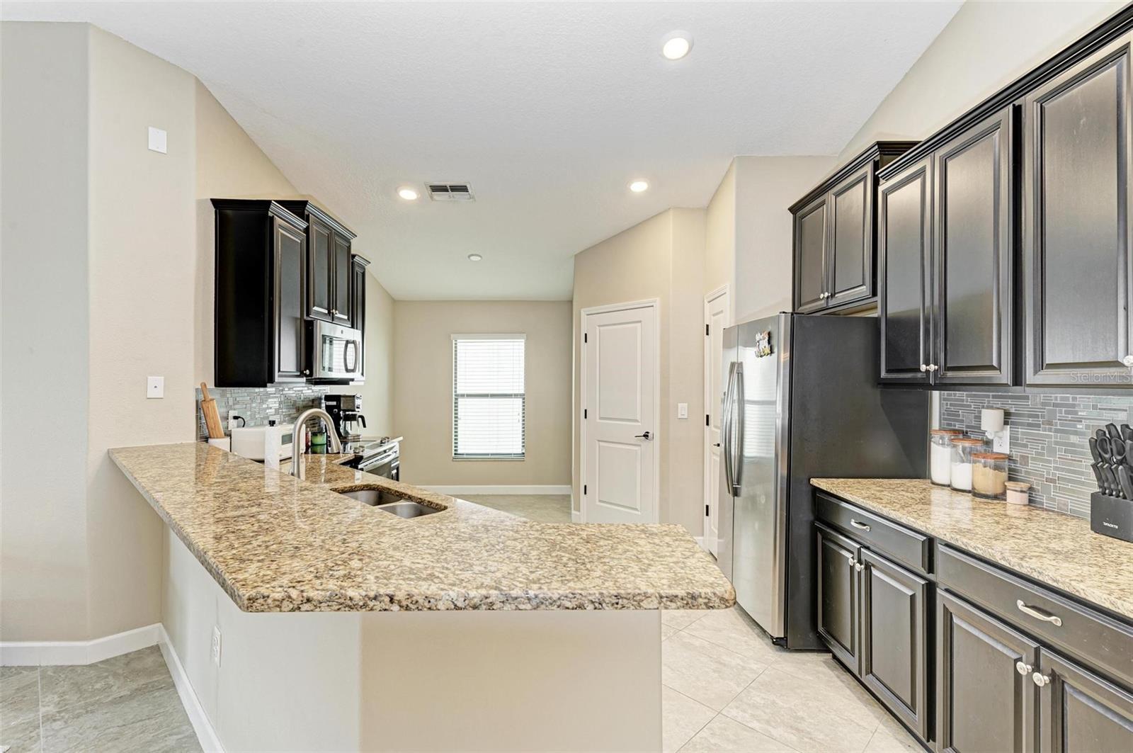 Chef's kitchen!  Spacious and modern.  Door to laundry room/garage